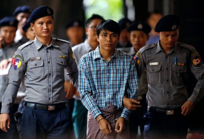 Detained Reuters journalist Kyaw Soe Oo arrives at Insein court in Yangon