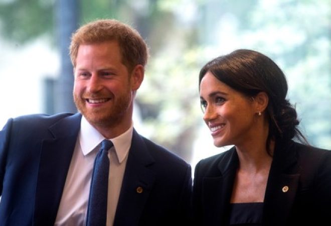 Príncipe Harry e a mulher, Meghan, durante evento em Londres