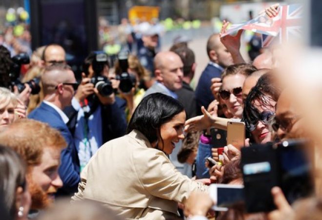 Príncipe Harry e a mulher, Meghan, durante visita à Austrália