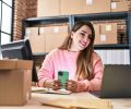 Young beautiful hispanic woman ecommerce business worker using smartphone at office