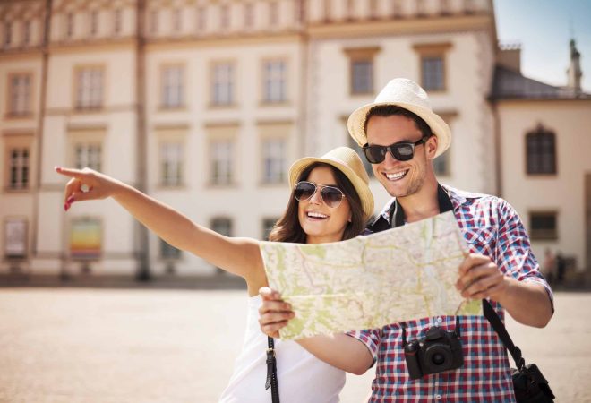 Happy tourist sightseeing city with map