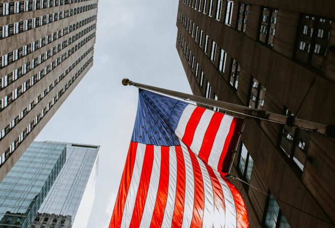 MANHATTAN, UNITED STATES - Aug 14, 2018: The US flags fluttering from a Manhattan building.