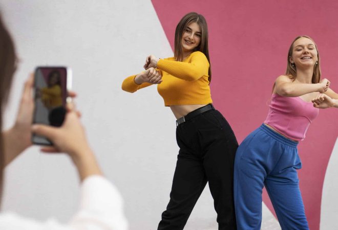 young-teenage-girls-recording-reels-themselves-outdoors-social-media